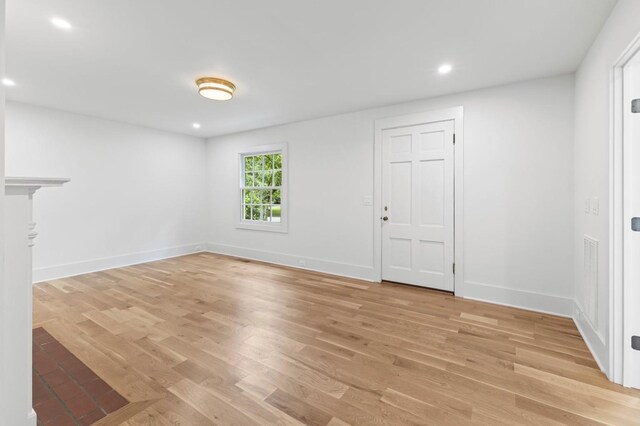 215 Lewisburg Ave, Franklin, TN 37064 - unfurnished living room featuring baseboards, recessed lighting, and light wood-style flooring
