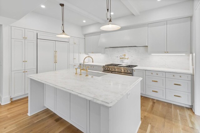 215 Lewisburg Ave, Franklin, TN 37064 - kitchen featuring a sink, premium range hood, high quality appliances, beam ceiling, and tasteful backsplash