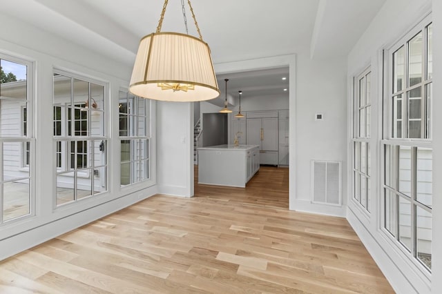 215 Lewisburg Ave, Franklin, TN 37064 - unfurnished dining area with baseboards and light wood-style floors