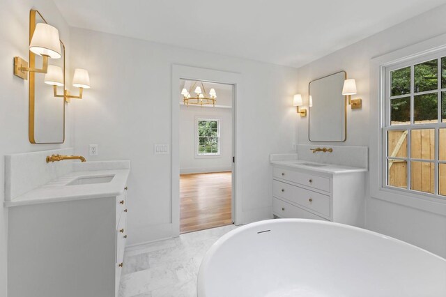 215 Lewisburg Ave, Franklin, TN 37064 - full bath with a chandelier, healthy amount of natural light, and two vanities