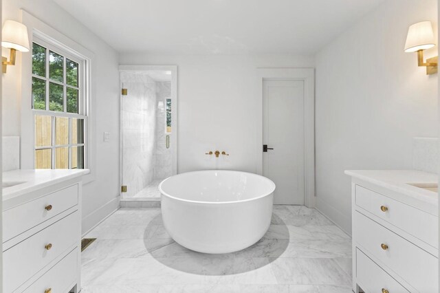 215 Lewisburg Ave, Franklin, TN 37064 - full bathroom featuring vanity, a stall shower, a soaking tub, marble finish flooring, and baseboards