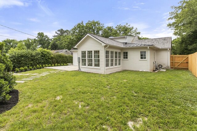 215 Lewisburg Ave, Franklin, TN 37064 - rear view of house featuring a patio area, a standing seam roof, and metal roof