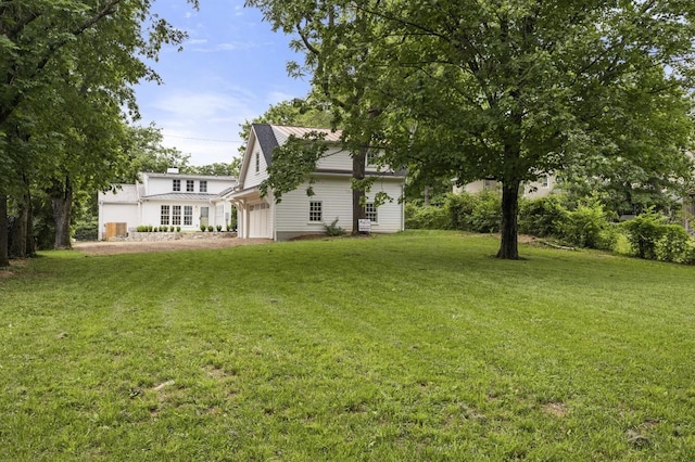 215 Lewisburg Ave, Franklin, TN 37064 - view of green lawn featuring an attached garage