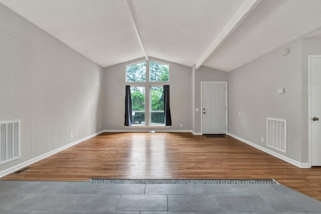 unfurnished living room with tile patterned floors and baseboards
