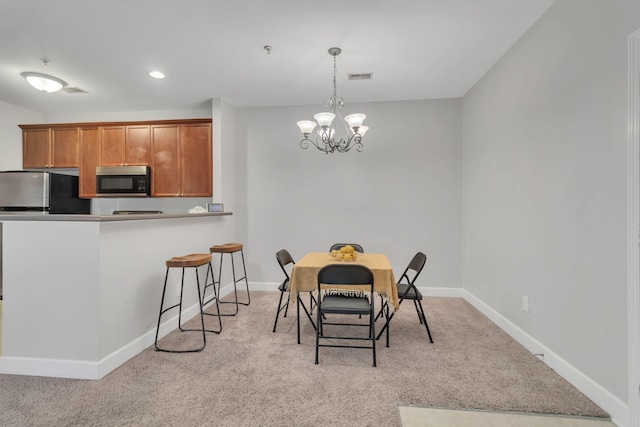 7230 Althorp Way Unit W 12, Nashville, TN 37211 - dining space featuring light colored carpet, a chandelier, and baseboards