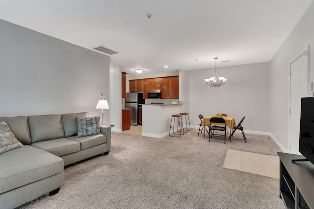 7230 Althorp Way Unit W 12, Nashville, TN 37211 - living room featuring a chandelier, light carpet, and baseboards