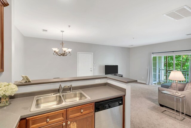 7230 Althorp Way Unit W 12, Nashville, TN 37211 - kitchen featuring stainless steel dishwasher, open floor plan, a sink, carpet flooring, and brown cabinetry