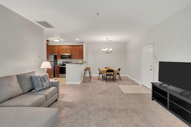 7230 Althorp Way Unit W 12, Nashville, TN 37211 - living area featuring a chandelier, light colored carpet, baseboards, and recessed lighting