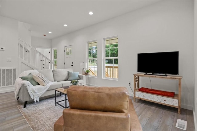 1014 Promise Land Rd, Charlotte, TN 37036 - living room featuring stairs, wood finished floors, and recessed lighting