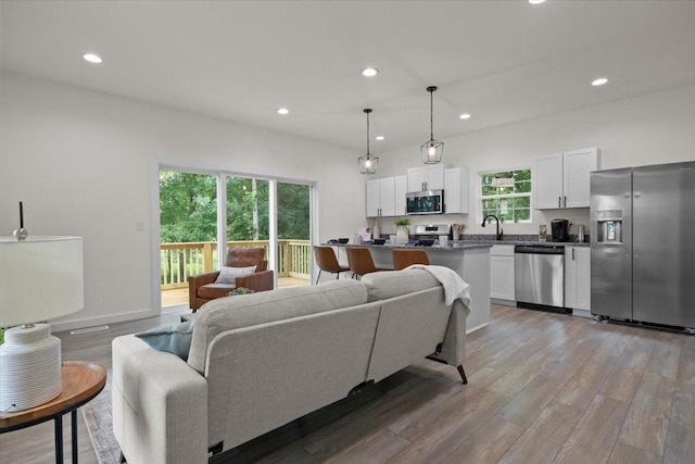 1014 Promise Land Rd, Charlotte, TN 37036 - living area featuring light wood finished floors and recessed lighting