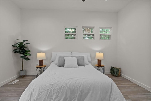 1014 Promise Land Rd, Charlotte, TN 37036 - bedroom with baseboards and wood finished floors
