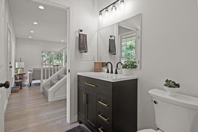 1014 Promise Land Rd, Charlotte, TN 37036 - bathroom featuring plenty of natural light, vanity, wood finished floors, recessed lighting, and connected bathroom