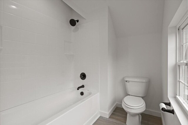 1014 Promise Land Rd, Charlotte, TN 37036 - full bathroom featuring wood finished floors, washtub / shower combination, and plenty of natural light