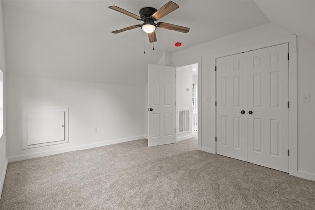 1014 Promise Land Rd, Charlotte, TN 37036 - unfurnished bedroom with vaulted ceiling, carpet, a closet, and ceiling fan