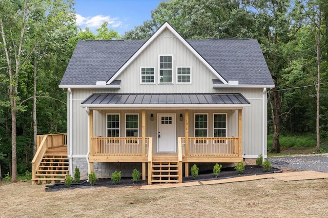 1014 Promise Land Rd, Charlotte, TN 37036 - modern farmhouse style home with stairs, a standing seam roof, a shingled roof, and covered porch