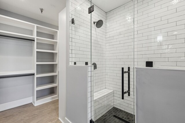 205 31st Ave N Unit 111, Nashville, TN 37203 - full bath with wood finished floors, a stall shower, and a spacious closet