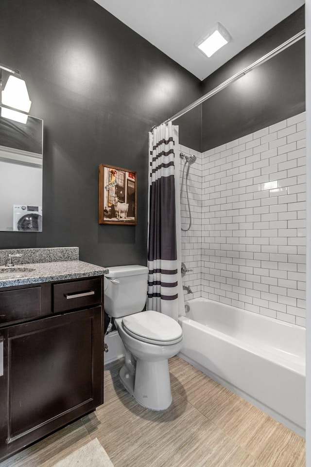 full bathroom featuring vanity, toilet, and shower / tub combo