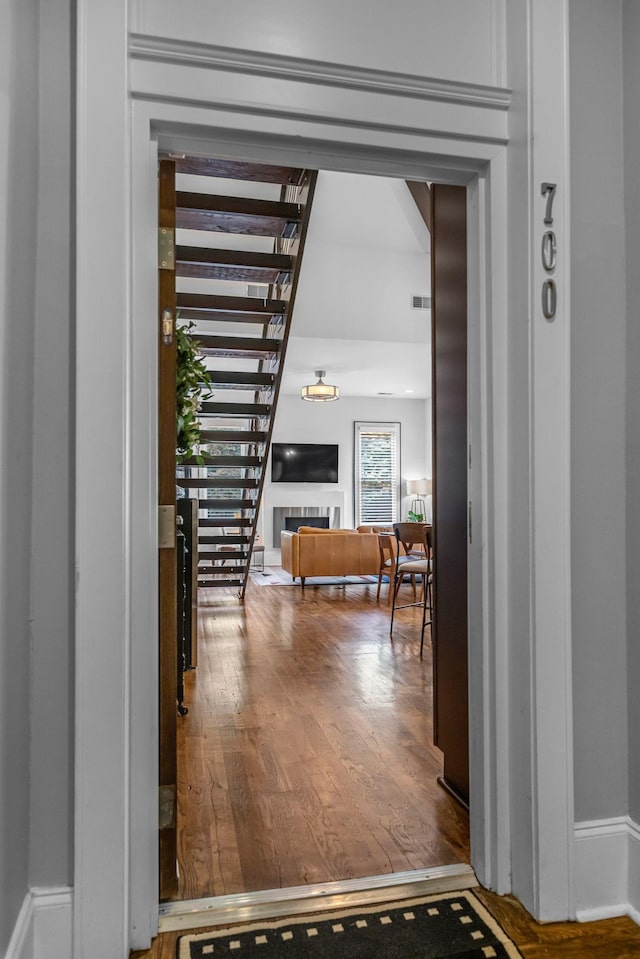 hall with wood finished floors