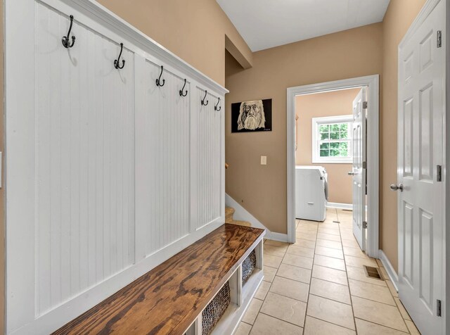 212 Spirit Hill Cir, Smyrna, TN 37167 - mudroom featuring light tile patterned floors, baseboards, and washer / clothes dryer