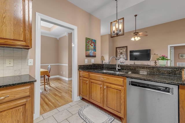 212 Spirit Hill Cir, Smyrna, TN 37167 - kitchen with stainless steel dishwasher, a sink, backsplash, dark stone countertops, and light tile patterned floors