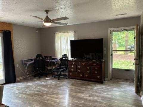 261 Oak Dr, Beechgrove, TN 37018 - office space featuring a textured ceiling, wood finished floors, and a ceiling fan