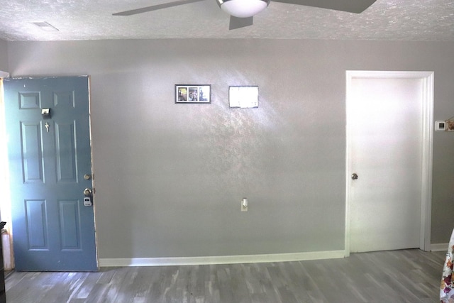 261 Oak Dr, Beechgrove, TN 37018 - entryway featuring a textured ceiling, wood finished floors, baseboards, and ceiling fan