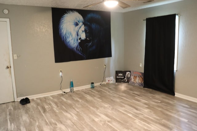 261 Oak Dr, Beechgrove, TN 37018 - unfurnished living room with wood finished floors, a ceiling fan, and baseboards