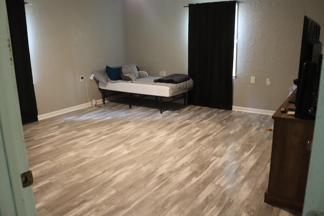 261 Oak Dr, Beechgrove, TN 37018 - bedroom featuring wood finished floors, baseboards, and a textured wall