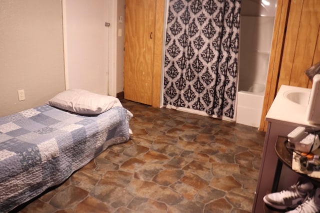 261 Oak Dr, Beechgrove, TN 37018 - bedroom featuring stone floors and a sink