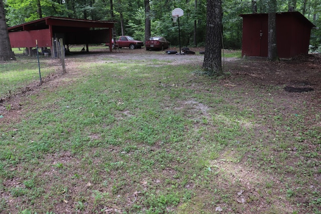 261 Oak Dr, Beechgrove, TN 37018 - view of yard with a carport and a forest view