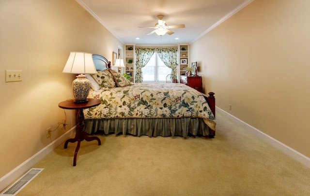 carpeted bedroom featuring crown molding, baseboards, and ceiling fan