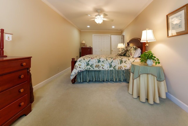 bedroom with carpet, ornamental molding, baseboards, a closet, and a ceiling fan