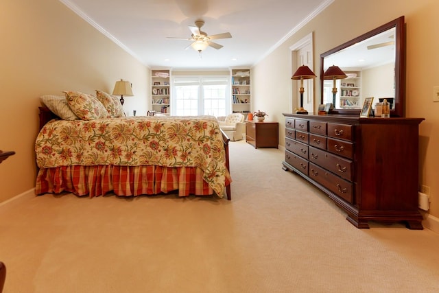 bedroom featuring light colored carpet, crown molding, ceiling fan, and baseboards