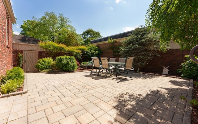 view of patio / terrace featuring outdoor dining area and fence