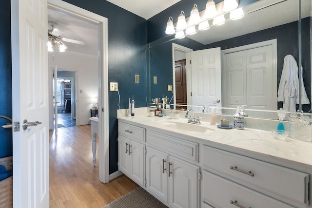 3310 Booker Ridge Rd, Mount Pleasant, TN 38474 - bathroom featuring wood finished floors, ceiling fan, and vanity