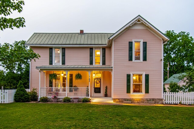 3310 Booker Ridge Rd, Mount Pleasant, TN 38474 - view of front facade with covered porch, metal roof, a standing seam roof, and a chimney