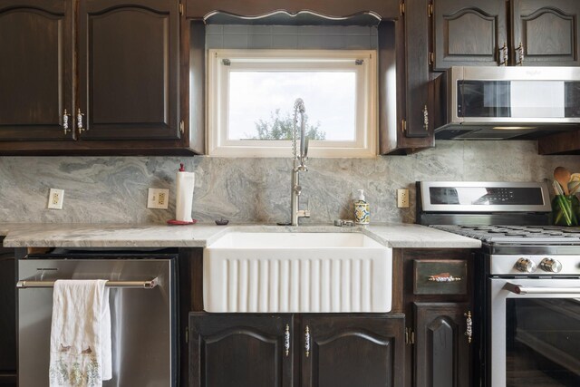3310 Booker Ridge Rd, Mount Pleasant, TN 38474 - kitchen featuring stainless steel appliances, a sink, light countertops, and decorative backsplash