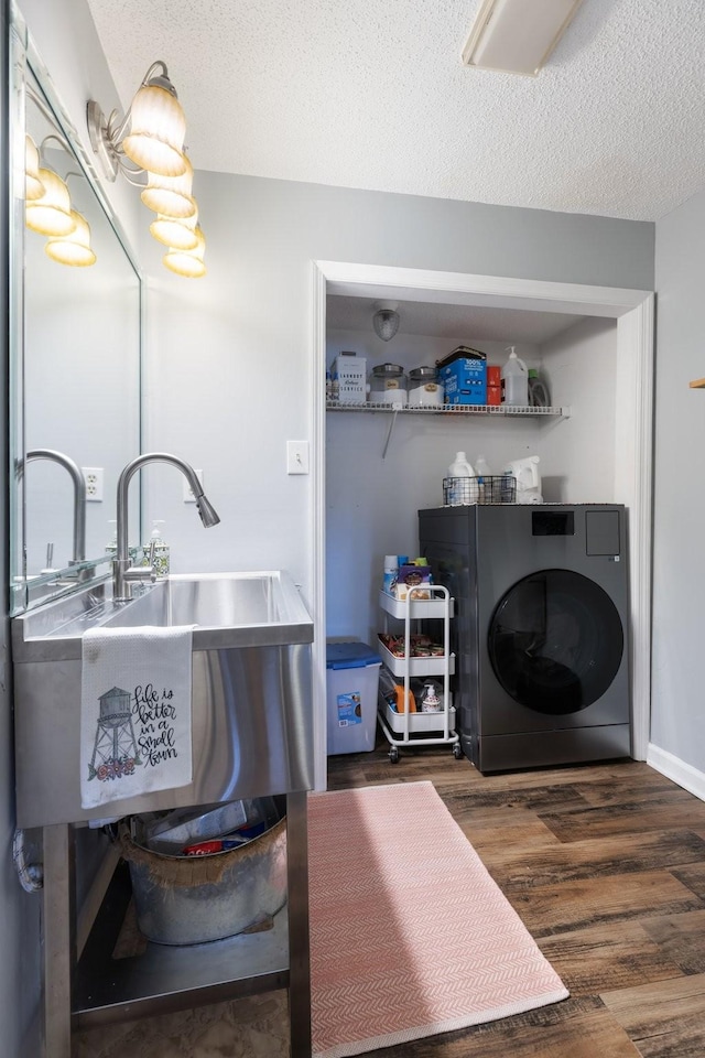 3310 Booker Ridge Rd, Mount Pleasant, TN 38474 - clothes washing area with washer / clothes dryer, wood finished floors, and a textured ceiling