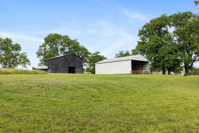 3310 Booker Ridge Rd, Mount Pleasant, TN 38474 - view of grassy yard featuring an outbuilding and an outdoor structure