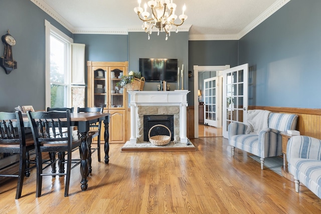 3310 Booker Ridge Rd, Mount Pleasant, TN 38474 - dining area with a chandelier, wood finished floors, crown molding, and a stone fireplace