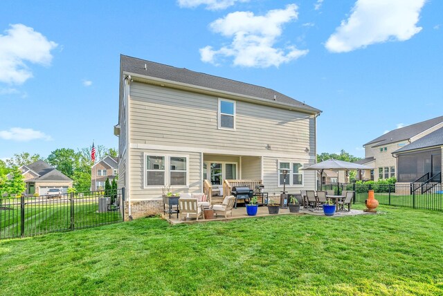 rear view of house featuring an outdoor living space and a patio