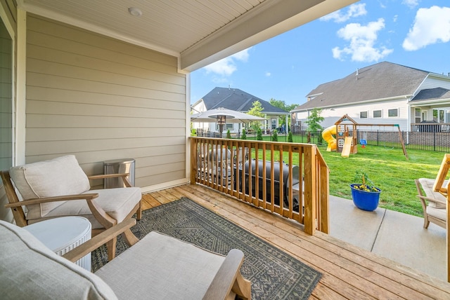 wooden deck featuring a residential view and a playground