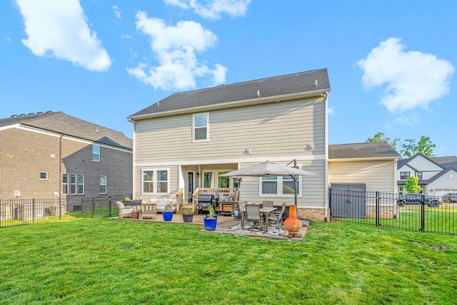 back of house with an outdoor hangout area and a patio area