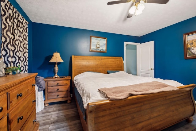 bedroom featuring wood finished floors and a ceiling fan
