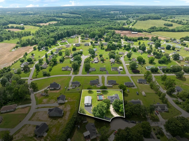 aerial view of property and surrounding area featuring property boundaries highlighted