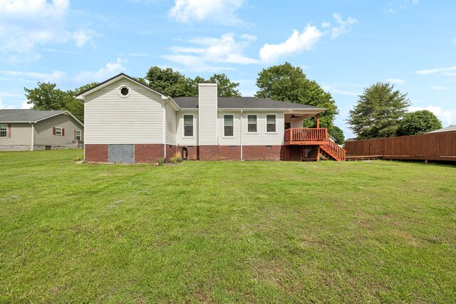 rear view of property featuring a chimney, stairs, crawl space, and a ceiling fan