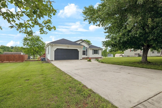 ranch-style home with a garage and concrete driveway