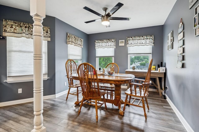 dining area featuring a ceiling fan, wood finished floors, and baseboards