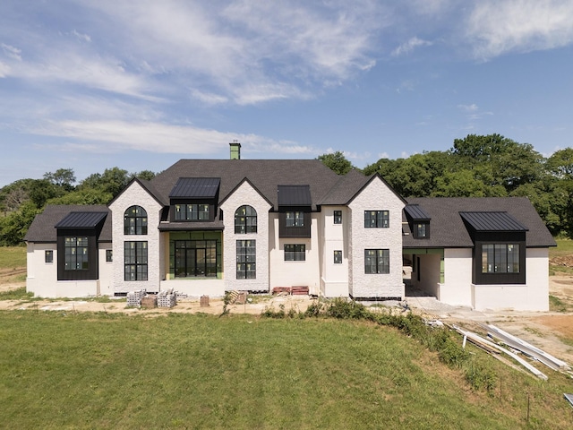 7007 Belcastle Ln, College Grove, TN 37046 - french country home featuring a front yard, a chimney, stucco siding, and a shingled roof