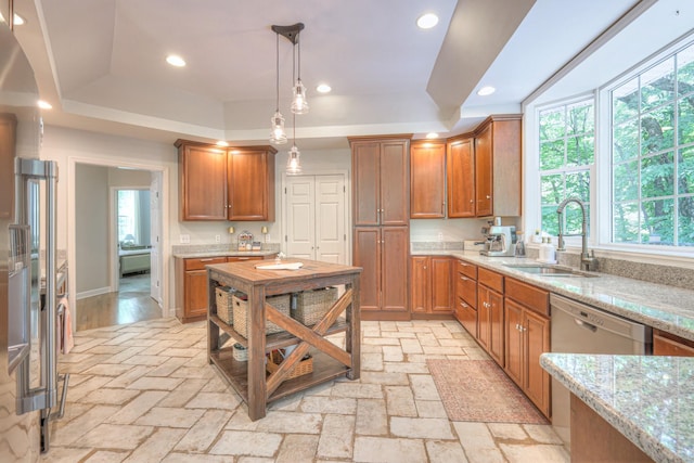 114 Moonlight Dr, Gallatin, TN 37066 - kitchen featuring a sink, a raised ceiling, healthy amount of natural light, light stone countertops, and recessed lighting